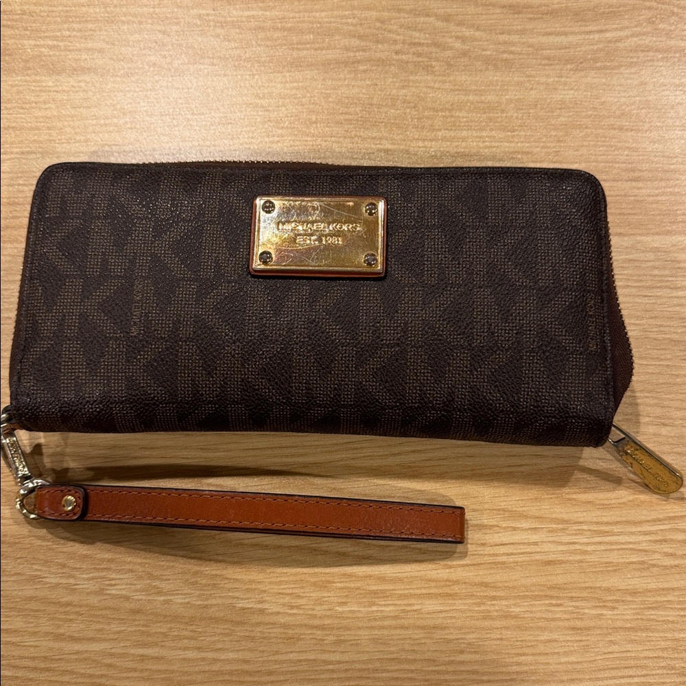 Michael Kors Dark Brown Monogram Wristlet with Gold Plate